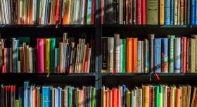 brightly colored books on a bookshelf