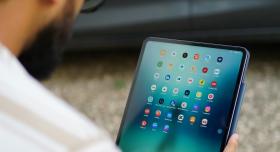 Man viewing an iPad home screen