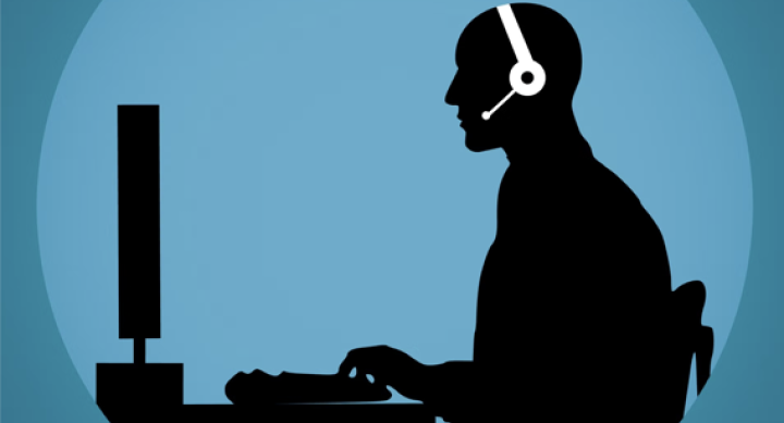 Support person at computer desk