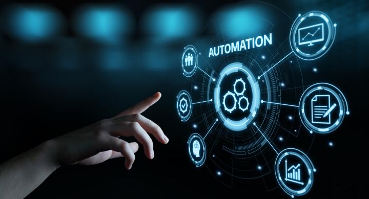 hand reaching out into digital space showing connected tasks for centralized automation